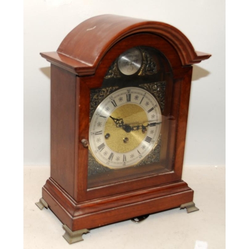 376 - Oak cased chiming mantel clock 'Tempus Fugit'. 38.5cms tall. Seen working at time of listing