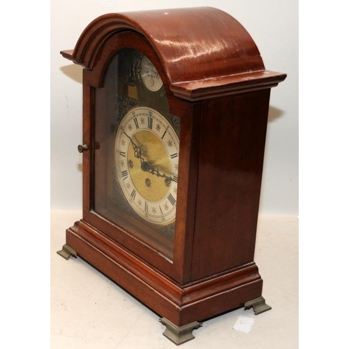 376 - Oak cased chiming mantel clock 'Tempus Fugit'. 38.5cms tall. Seen working at time of listing