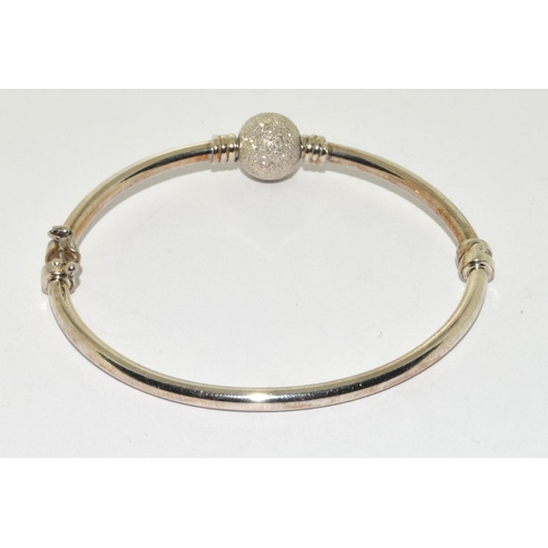 382 - 925 silver bangle set with a glitter ball charm