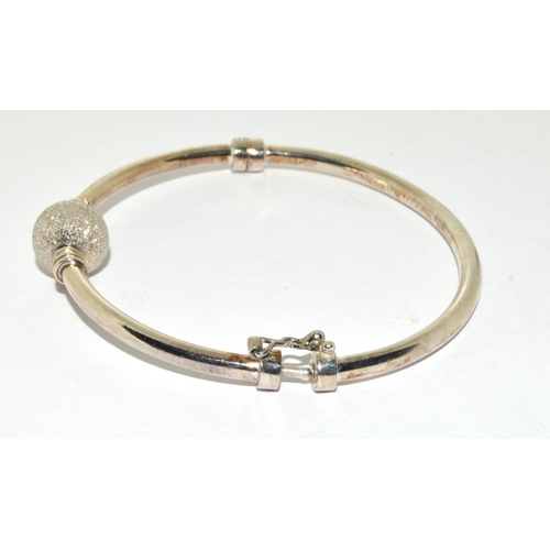 382 - 925 silver bangle set with a glitter ball charm