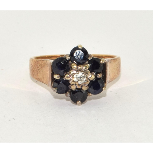 255 - 9ct gold ladies Diamond and Sapphire cluster ring size N