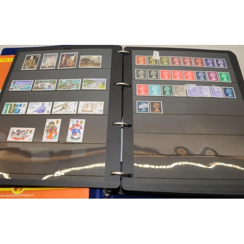 201 - A collection of mint GB stamps including a stock book, loose and framed examples. Includes high valu... 