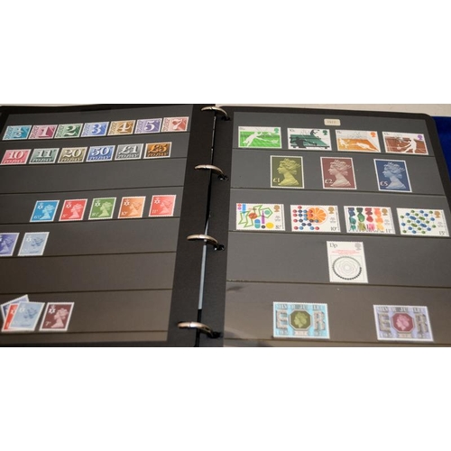 201 - A collection of mint GB stamps including a stock book, loose and framed examples. Includes high valu... 