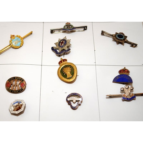 132A - A collection of vintage enamel badges to include military, RBL etc