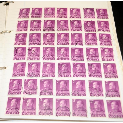 200A - A large collection of world stamps contained within a number of albums and stock books including ear... 