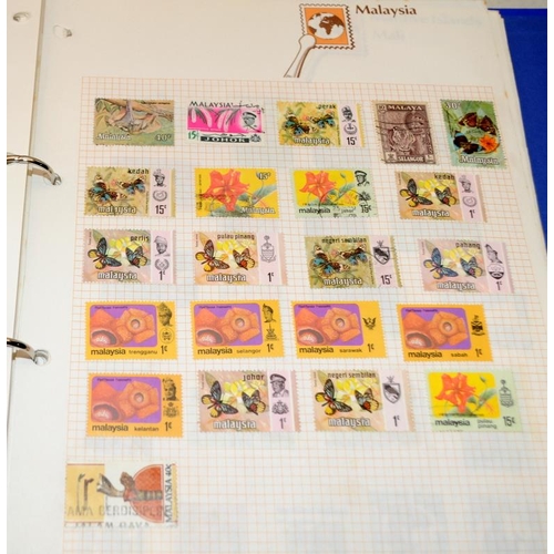 200A - A large collection of world stamps contained within a number of albums and stock books including ear... 