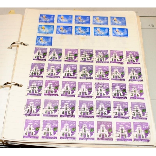 224 - A large collection of world stamps contained within a number of albums and stock books including ear... 