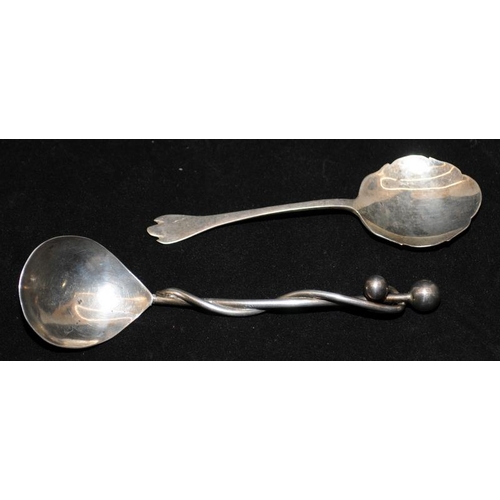 355 - Two sterling silver jam spoons, One hallmarked for Sheffield 1959 and an unusual example featuring a... 