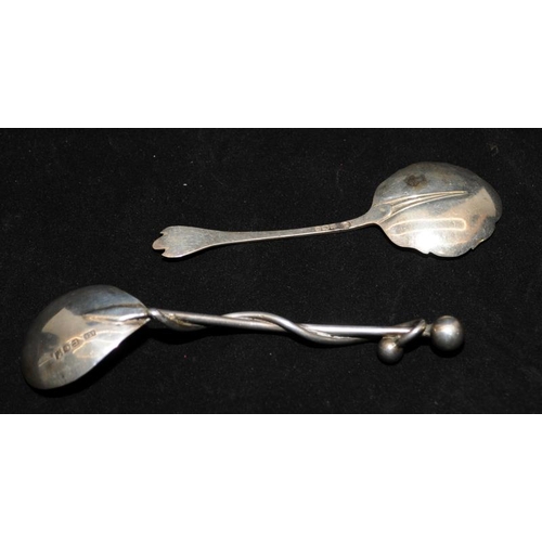 355 - Two sterling silver jam spoons, One hallmarked for Sheffield 1959 and an unusual example featuring a... 