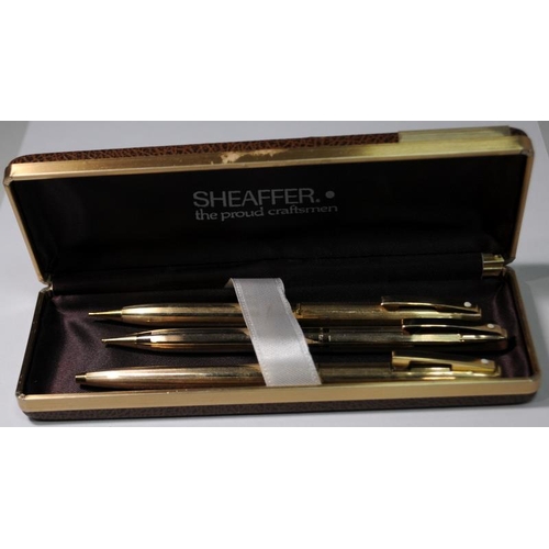 17 - Cased Shaeffer White Dot set comprising gold plated  ballpoint pen and two propelling pencils