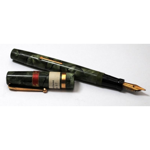 31 - Swan self fill fountain pen with green pearl and black marble body. Unused NOS still showing sticker... 