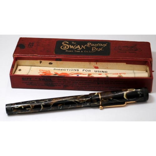 32 - Boxed Swan L205/47 leverless fountain pen. Black and gold with white lining body. Excellent conditio... 