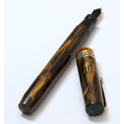 43 - Swan Visofil Mk1 fountain pen V211/64. Brown amber marbled body with wide gold plated filigree cap b... 