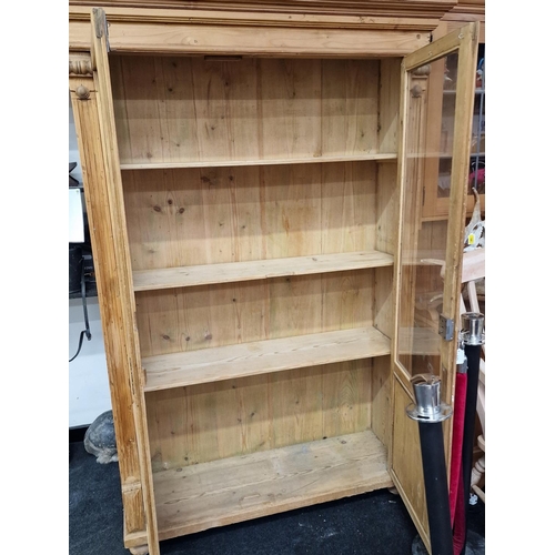 125 - Antique pine 2 door glassed bookshelf/cupboard set on stub feet with key 190x120x35cm