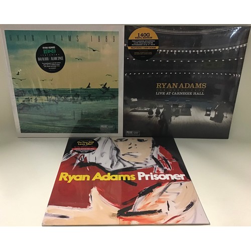 252 - COLLECTION OF 3 X RYAN ADAMS VINYL ALBUMS. These are still factory sealed and include a red limited ... 