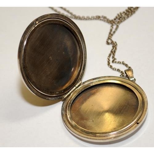 226 - Large engraved silver locket and chain