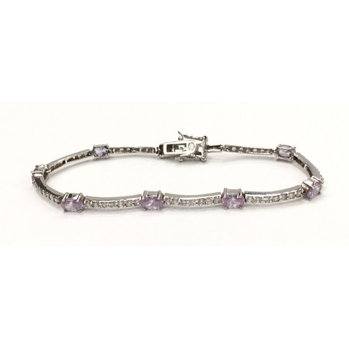 224 - Lavendar CZ white gold on 925 silver line bracelet.