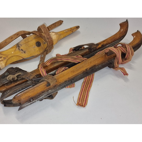 113 - Two pairs of vintage ice skates.