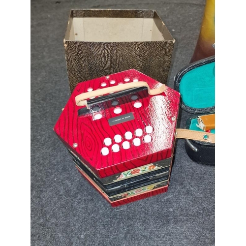 104 - Collection of musical instruments to include cased violin, German Squeezebox and a drum (3).