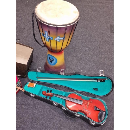 104 - Collection of musical instruments to include cased violin, German Squeezebox and a drum (3).