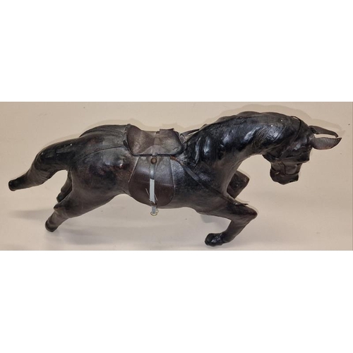 53 - Vintage 1950's leather model of a horse 42cm in length.