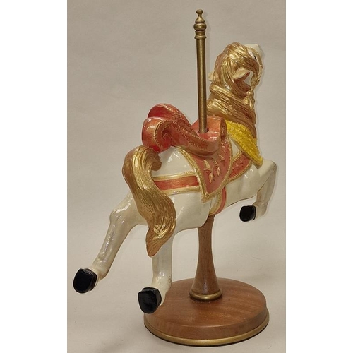 58 - An attractive large ceramic carousel horse ornament on wooden pole and base 37cm tall.