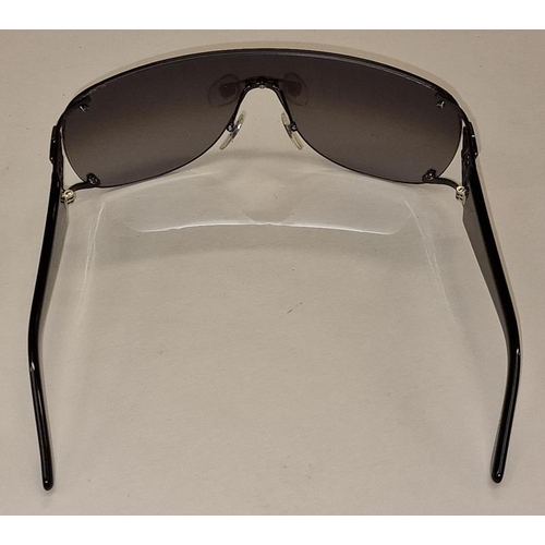 95 - A pair of ladies designer sunglasses with case and cleaning cloth.