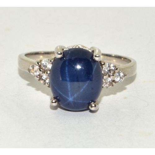 241 - A 925 silver and blue stone ring Size S