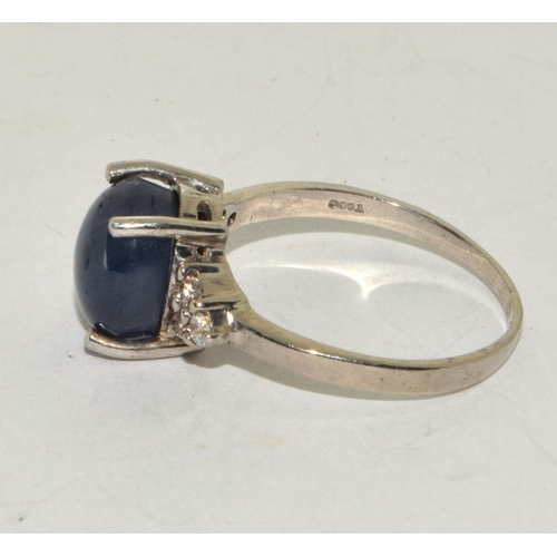 241 - A 925 silver and blue stone ring Size S