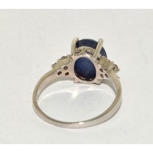 241 - A 925 silver and blue stone ring Size S