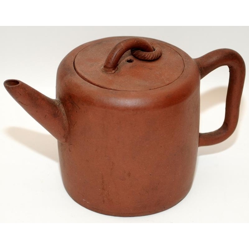 7 - Three Chinese oriental Yixing pottery brown teapots, two of the having marks to the undersides. The ... 