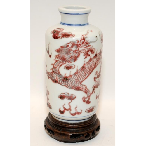 28 - Chinese iron red & underglaze blue dragons vase and stand, Guangxi six character mark to bas. 19th c... 