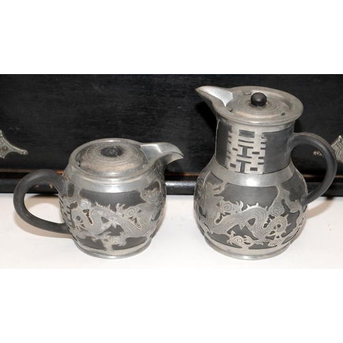 46 - A Chinese Yixing pottery & pewter six piece dragon tea service to include a teapot, two jugs and two... 