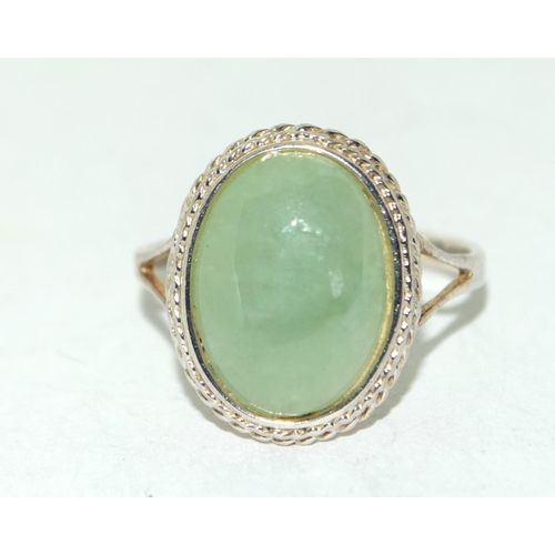 227 - A 925 silver and oval jadeite ring size O