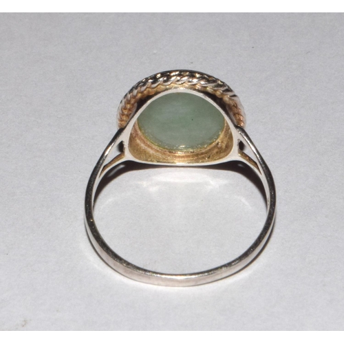 227 - A 925 silver and oval jadeite ring size O