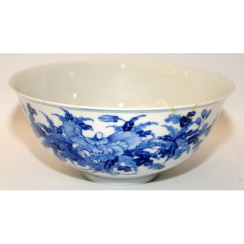 43 - A Chinese 19th century porcelain bowl painted with flowers, Guangxu mark to base. D17cm.