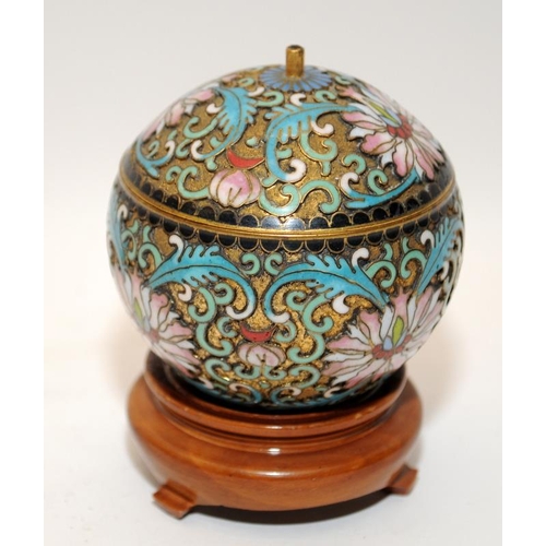 45 - Oriental cloisonne lidded pot of small proportions on wooden stand 9x6cm