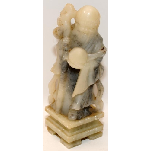 74 - Carved soap stone Immortal  on a plinth 20cm tall