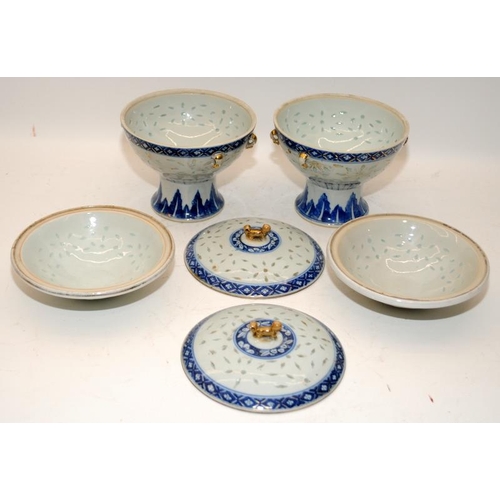 98 - A pair of Chinese 19th century Kangxi style rice grain tureens with inner bowls and finished with gi... 