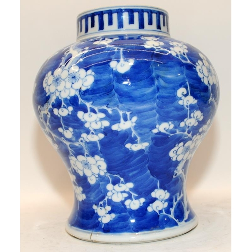 103 - A Large Oriental Chinese blue & white prunus decorated jar, (no lids,faults) H24cm.