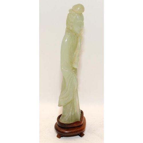 101 - Chinese celadon Jade figure of Kwanyin holding a branch of peaches on original fitted hardwood stand... 