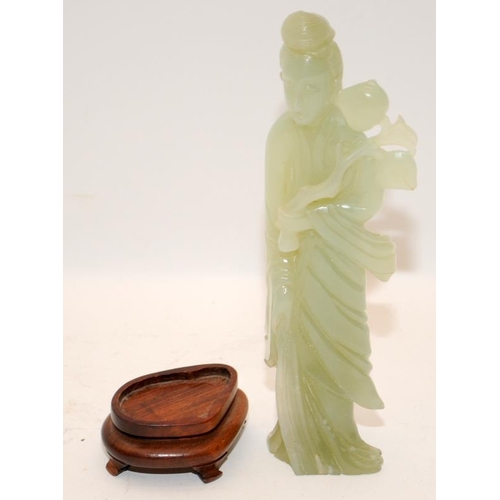 101 - Chinese celadon Jade figure of Kwanyin holding a branch of peaches on original fitted hardwood stand... 