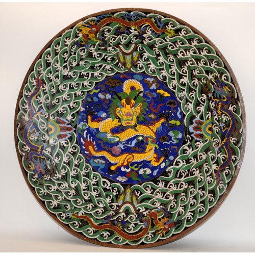 106 - A very large Chinese cloisonne enamel dragon charger (D60cm) and a similar vase H33cm.