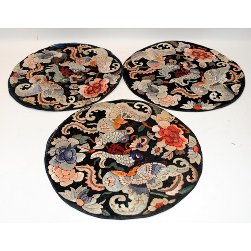 117 - A collection of six Chinese 19th century textile embroidery bats & flowers roundels together with a ... 