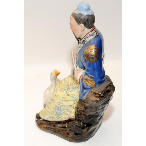 123 - Two Chinese porcelain statues of immortals, marked, 20th century, H21cm (both in good condition)