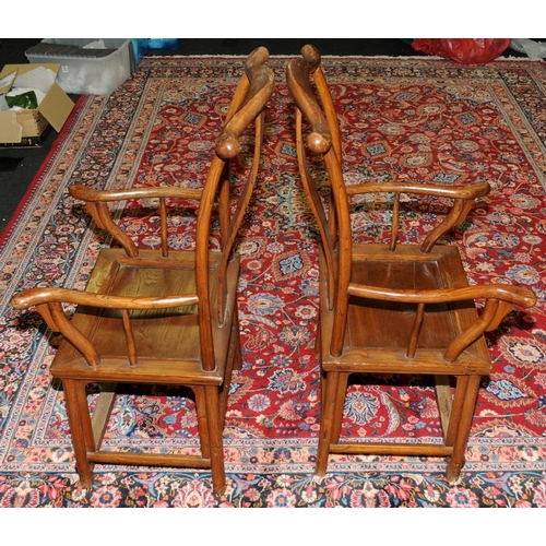 129 - A pair of Chinese late 19th century official yoke back chairs.