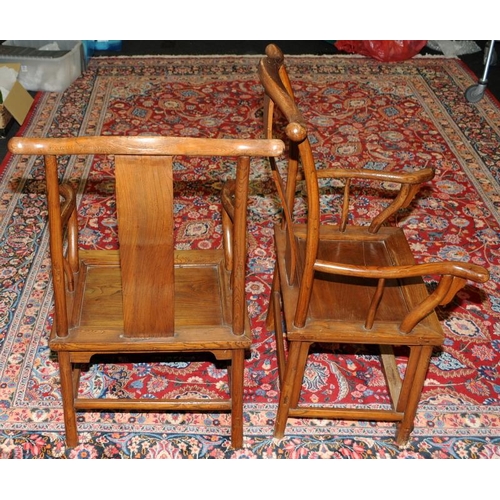 129 - A pair of Chinese late 19th century official yoke back chairs.