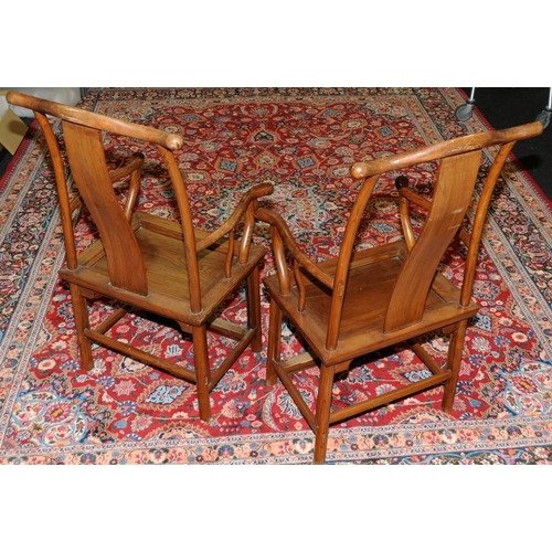 129 - A pair of Chinese late 19th century official yoke back chairs.