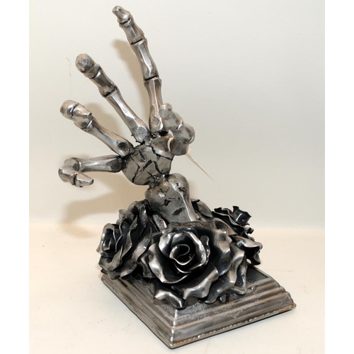 444 - Sculptural Gothic black rose with skeletal hand bottle holder cast in metal. 28cms tall