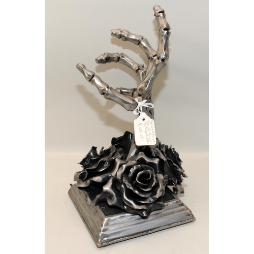 444 - Sculptural Gothic black rose with skeletal hand bottle holder cast in metal. 28cms tall